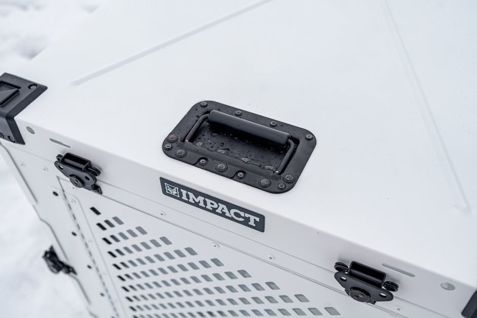 Durable Impact dog crate photographed in a snowy setting, showcasing quality design and waterproof capability.